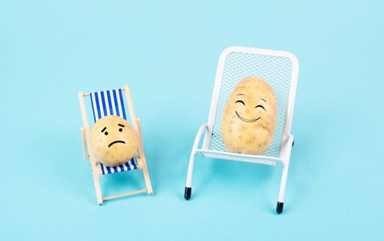 Potatoes with funny faces sitting in lounge chairs and having a conversation, the small one is sad, the big one smiles, child with mother or father, holiday greeting card