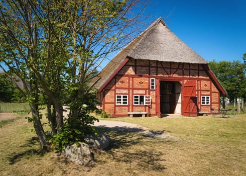 Beautiful house with a thatched roof on the Baltic Sea.