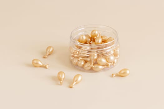 Beauty serum capsules in a jar on light yellow close up. Skincare cosmetics. Facial treatment with perfect dosage of serum to be used. Pastel minimal composition..