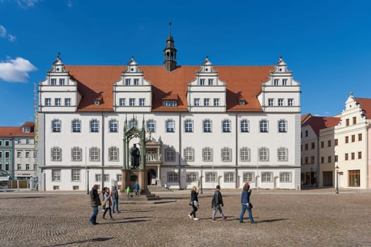 City Hall of Wittenberg with the monument of the reformer Martin Luther standing in front of it