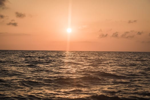 Beautiful bright purple sunrise on the ocean