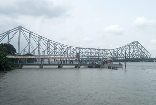 The Howrah Bridge, a balanced attached cantilever bridge covering over the Hooghly River in West Bengal, India, South Asia Pacific June 28, 2022