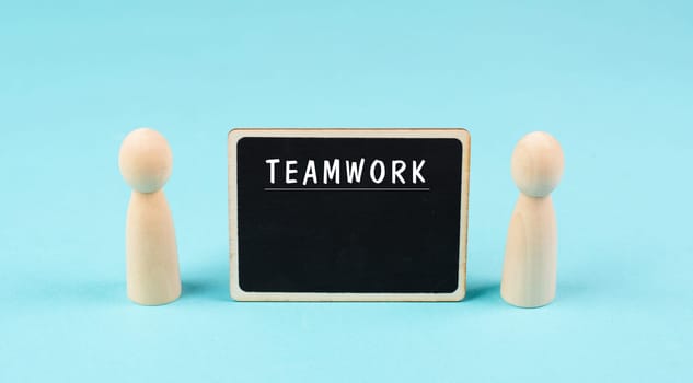 The word teamwork is standing on a chalkboard, working together, corporate in team, communication and support concept