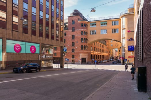 Stockholm, Sweden - June 25 2022: Norrmalm district in central Stockholm, with few pedestrians, and low traffic, in a sunny summer day