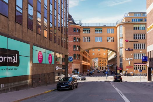 Stockholm, Sweden - June 25 2022: Norrmalm district in central Stockholm, with few pedestrians, and low traffic, in a sunny summer day