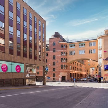 Stockholm, Sweden - June 25 2022: Norrmalm district in central Stockholm, with few pedestrians, and low traffic, in a sunny summer day