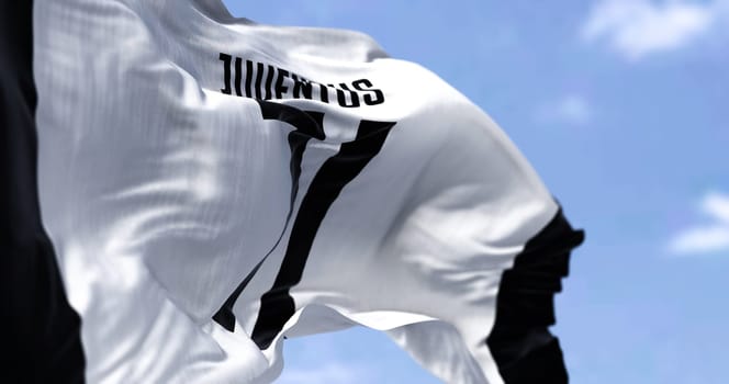 Turin, Italy, July 2022: The flag of Juventus Football Club waving. Juventus is a professional football club based in Turin. Italy