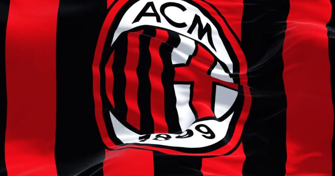 Milan, Italy, July 2022: The flag of A.C. Milan waving in the wind. Milan is a professional football club based in Milan, Italy