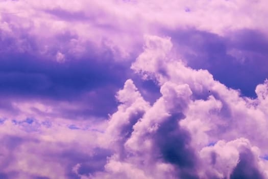 Beautiful pink storm clouds on a blue sky. Beauty of nature. Natural background..