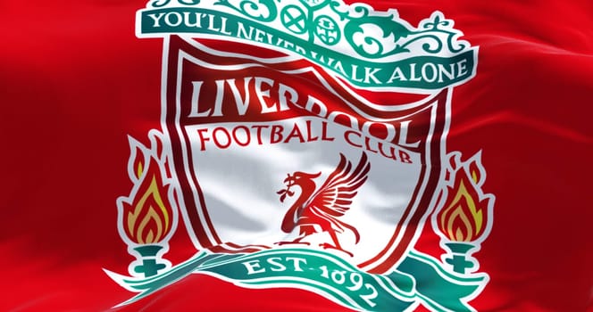 Liverpool, UK, July 2022: The flag of Liverpool Football Club waving. Liverpool F.C. is a professional football club based in Liverpool, England