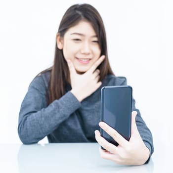 Woman long hair Woman using mobile phone and  writing notebook on white background