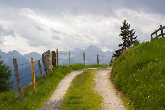 Landscape of Lienz Dolomites in Austria. Road and panorama of massive Alpine mountains. East Tyrol
