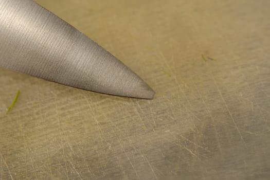 close up old knife with a chipped blade. broken substandard knife, broken end of the knife.