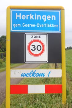 The town sign of the city of Herkingen, Netherlands.Das Ortsschild der Stadt Herkingen, Niederlande.