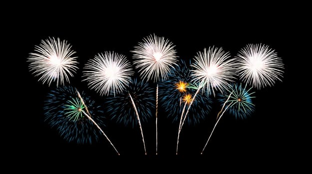 Beautiful fireworks display on night sky. Celebration and anniversary concept.