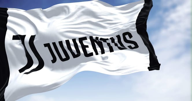 Turin, Italy, July 2022: The flag of Juventus Football Club waving. Juventus is a professional football club based in Turin. Italy