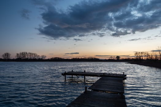 Wooden pier on the lake and the evening sky, Stankow, Poland