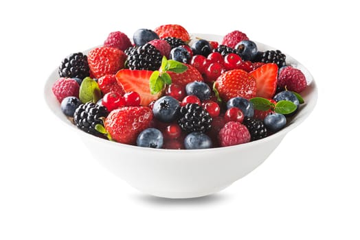 Bowl of healthy fresh berry fruit salad isolated on white background