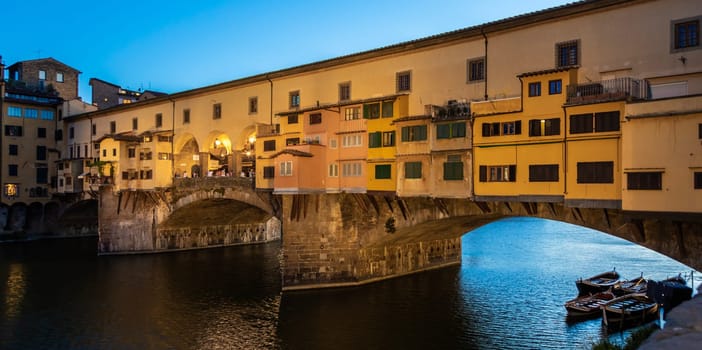 Florence, Italy - Circa June 2021: sunset on Ponte Vecchio - Old Bridge. Amazing blue light before the evening.