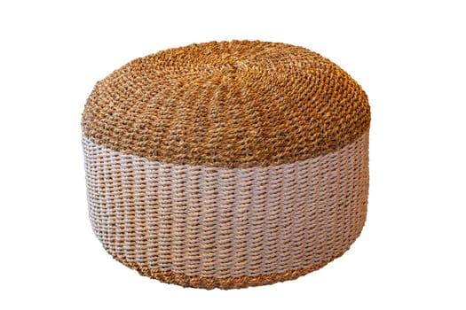 Wicker furniture. Close-up of a wickerwork stool in round shape as seating in hotels and by the pool isolated on a white background. Pool accessories.