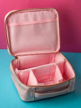 empty open pink makeup bag close-up. High quality photo
