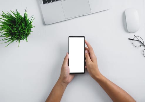 phone mobile white screen in hand on white table