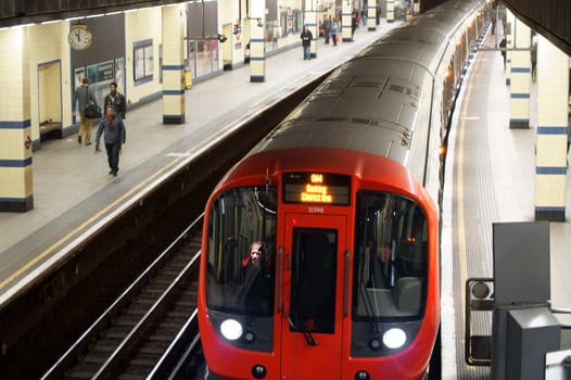 London,United Kingdom – March 31,2015: A London underground tram of the District Line stops at an underground station on March 31,2015 in London.