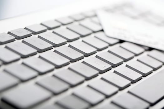 Macro of a credit cards on a computer keyboard.