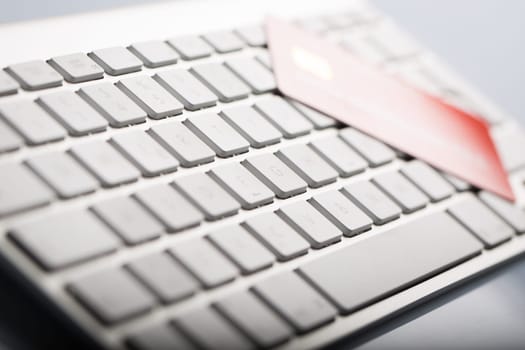 Macro of a credit cards on a computer keyboard.
