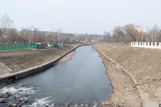 Shallowed river in the city center