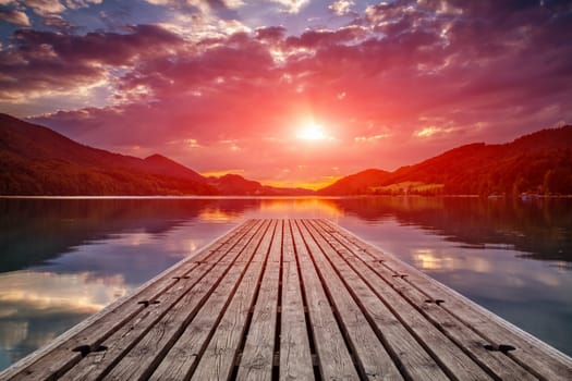 Beautiful sunset view from a wooden platform in Fusch am see, Austria