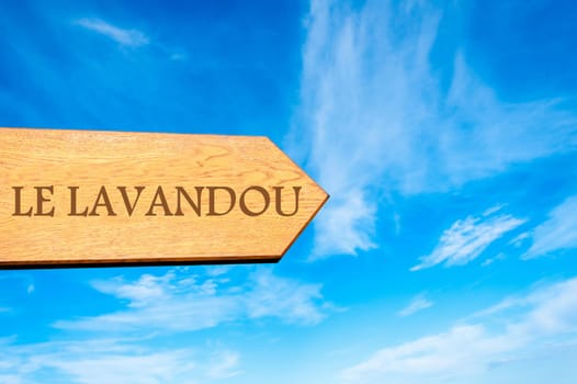 Wooden arrow sign pointing destination Versailles, FRANCE against clear blue sky with copy space available. Travel destination conceptual image