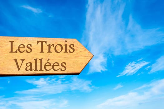 Wooden arrow sign pointing destination Versailles, FRANCE against clear blue sky with copy space available. Travel destination conceptual image