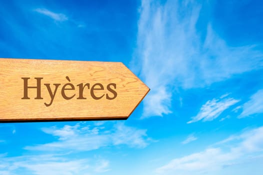 Wooden arrow sign pointing destination Versailles, FRANCE against clear blue sky with copy space available. Travel destination conceptual image