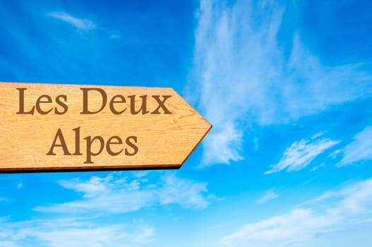 Wooden arrow sign pointing destination Versailles, FRANCE against clear blue sky with copy space available. Travel destination conceptual image