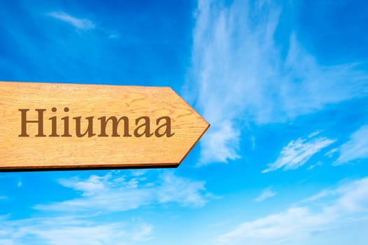Wooden arrow sign pointing destination TALLINN, ESTONIA against clear blue sky with copy space available. Travel destination conceptual image