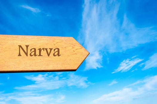 Wooden arrow sign pointing destination TALLINN, ESTONIA against clear blue sky with copy space available. Travel destination conceptual image