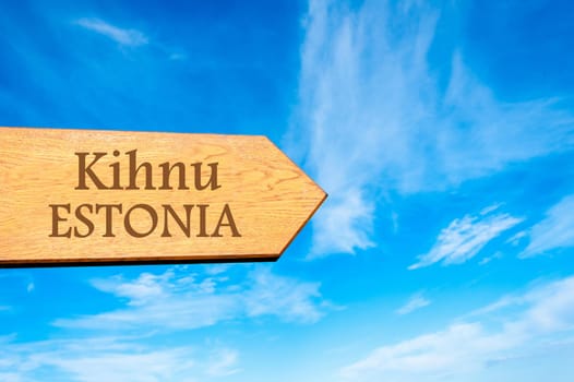 Wooden arrow sign pointing destination TALLINN, ESTONIA against clear blue sky with copy space available. Travel destination conceptual image