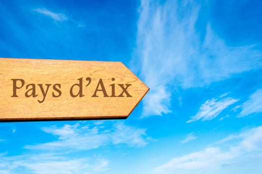 Wooden arrow sign pointing destination Versailles, FRANCE against clear blue sky with copy space available. Travel destination conceptual image