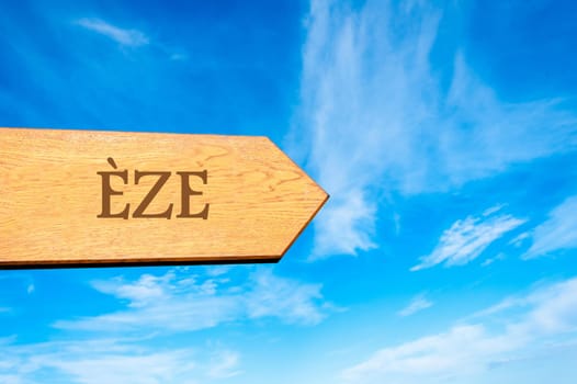 Wooden arrow sign pointing destination Versailles, FRANCE against clear blue sky with copy space available. Travel destination conceptual image
