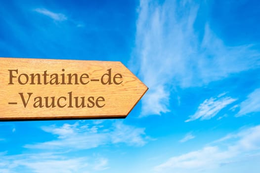Wooden arrow sign pointing destination Versailles, FRANCE against clear blue sky with copy space available. Travel destination conceptual image