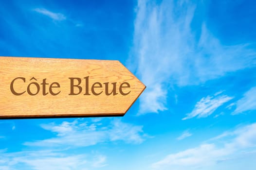 Wooden arrow sign pointing destination Versailles, FRANCE against clear blue sky with copy space available. Travel destination conceptual image