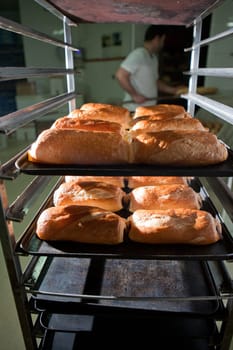 Racks of freshly baked neapolitan cakes