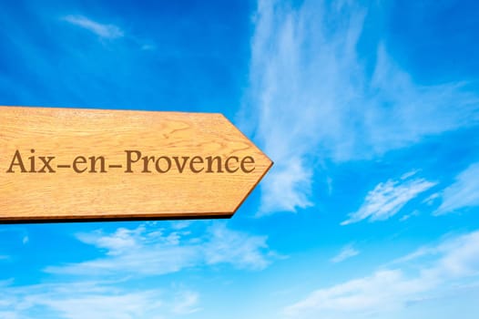 Wooden arrow sign pointing destination Versailles, FRANCE against clear blue sky with copy space available. Travel destination conceptual image