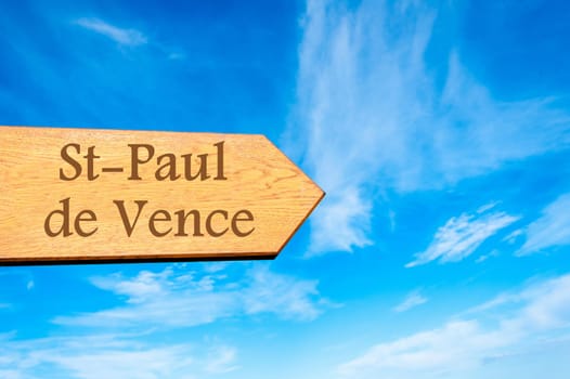 Wooden arrow sign pointing destination Versailles, FRANCE against clear blue sky with copy space available. Travel destination conceptual image