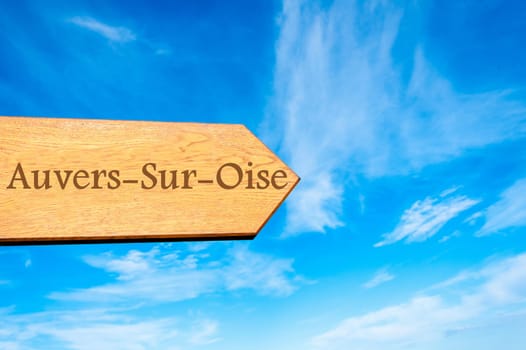 Wooden arrow sign pointing destination Versailles, FRANCE against clear blue sky with copy space available. Travel destination conceptual image