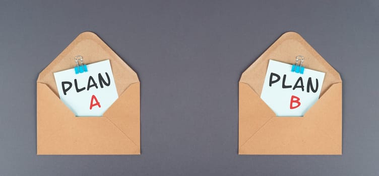 Plan A and B standing on paper, brainstorming for possibilities, making a decision
