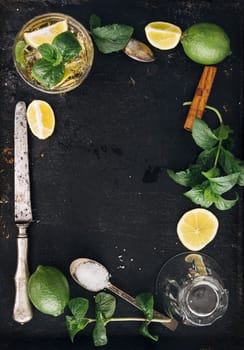 Mojito ingredients on black rustic background. Top view frame design with copyspace.