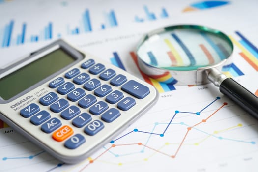 Calculator on chart and graph spreadsheet paper. Finance development, Banking Account, Statistics, Investment Analytic research data economy, Stock exchange trading, Business company concept.