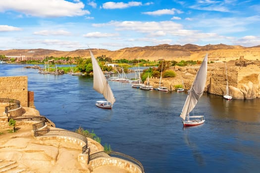 The Nile river scenery  and traditional sailboats, Aswan, Egypt.